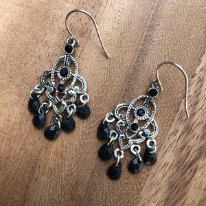 Silver tone dangle earrings with black beads